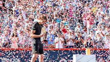 MONTREAL, QC - AUGUST 13: Confetti is blown as Alexander Zverev of Germany makes his way onto the stage with the trophy after defeating Roger Federer of Switzerland 6-3, 6-4 in the final during day ten of the Rogers Cup presented by National Bank at Uniprix Stadium on August 13, 2017 in Montreal, Quebec, Canada. (Photo by Minas Panagiotakis/Getty Images)