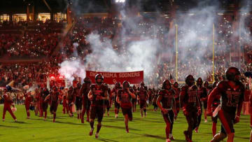 Oklahoma runs on to the field before the college football game between the University of Oklahoma Sooners and the West Virginia Mountaineers at Gaylord Family-Oklahoma Memorial Stadium in Norman, Okla., Saturday, Nov., 11, 2023.
