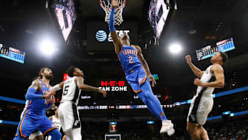 JANUARY 2: Shai Gilgeous-Alexander #2 of the OKC Thunder flies past Bryn Forbes #11 of the San Antonio Spurs. (Photo by Ronald Cortes/Getty Images)