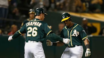 OAKLAND, CA - AUGUST 07: Khris Davis #2 of the Oakland Athletics celebrates with teammate Matt Chapman #26 after hitting a two-run home run in the sixth inning against the Los Angeles Dodgers at Oakland Alameda Coliseum on August 7, 2018 in Oakland, California. (Photo by Lachlan Cunningham/Getty Images)