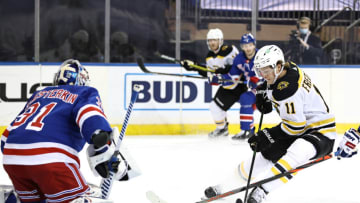 Feb 12, 2021; New York, New York, USA; Boston Bruins center Trent Frederic (11) heads for the net against New York Rangers goaltender Igor Shesterkin (31) in the first period at Madison Square Garden. Mandatory Credit: Elsa/Pool Photos-USA TODAY Sports