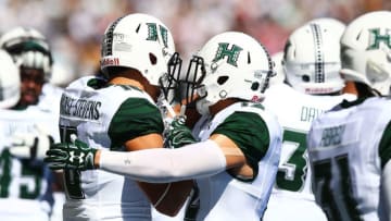 SYDNEY, AUSTRALIA - AUGUST 27: Hawai'i Rainbow Warrior players embrace before the College Football Sydney Cup match between University of California and University of Hawaii at ANZ Stadium on August 27, 2016 in Sydney, Australia. (Photo by Mark Nolan/Getty Images)