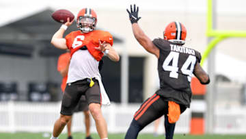 BEREA, OH - AUGUST 10: Quarterback Baker Mayfield #6 of the Cleveland Browns throws a pass over linebacker Sione Takitaki #44 during Cleveland Browns Training Camp on August 10, 2021 in Berea, Ohio. (Photo by Nick Cammett/Getty Images)