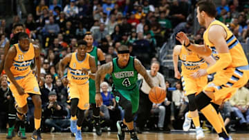 Feb 21, 2016; Denver, CO, USA; Boston Celtics guard Isaiah Thomas (4) dribbles the ball up court ahead of Denver Nuggets forward Kenneth Faried (35) and guard Emmanuel Mudiay (0) in the first quarter at the Pepsi Center. Mandatory Credit: Isaiah J. Downing-USA TODAY Sports