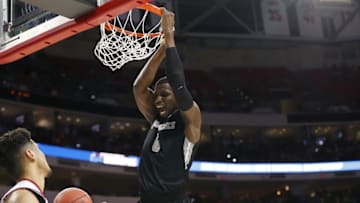 Mar 17, 2016; Raleigh, NC, USA; Providence Friars forward Ben Bentil (0) dunks the ball in front of USC Trojans forward Bennie Boatwright (25) during the first half at PNC Arena. Mandatory Credit: Geoff Burke-USA TODAY Sports