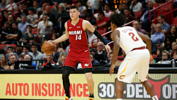 MIAMI, FLORIDA - NOVEMBER 20: Tyler Herro #14 of the Miami Heat drives to the basket against Collin Sexton #2 of the Cleveland Cavaliers during the second half at American Airlines Arena on November 20, 2019 in Miami, Florida. NOTE TO USER: User expressly acknowledges and agrees that, by downloading and/or using this photograph, user is consenting to the terms and conditions of the Getty Images License Agreement. (Photo by Michael Reaves/Getty Images)