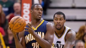 Dec 5, 2015; Salt Lake City, UT, USA; Utah Jazz forward Derrick Favors (15) defends against Indiana Pacers center Ian Mahinmi (28) during the first half at Vivint Smart Home Arena. The Jazz won in overtime 122-119. Mandatory Credit: Russ Isabella-USA TODAY Sports
