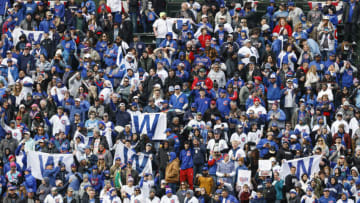 Mar 30, 2023; Chicago, Illinois, USA; Chicago Cubs fans celebrate their team win against the Milwaukee Brewers at Wrigley Field. Mandatory Credit: Kamil Krzaczynski-USA TODAY Sports