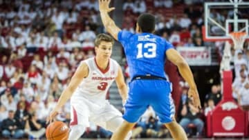 Jan 21, 2016; Fayetteville, AR, USA; Arkansas Razorbacks guard Dusty Hannahs (3) dribbles the ball while being guarded by Kentucky Wildcats guard Isiah Briscoe (13) during the first half of play at Bud Walton Arena. Mandatory Credit: Gunnar Rathbun-USA TODAY Sports