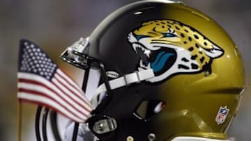 Dec 5, 2013; Jacksonville, FL, USA; A Jacksonville Jaguars helmet and an American flag in the third quarter of their game against the Houston Texans at EverBank Field. Mandatory Credit: Phil Sears-USA TODAY Sports