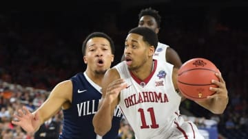 Apr 2, 2016; Houston, TX, USA; Oklahoma Sooners guard Isaiah Cousins (11) drives against Villanova Wildcats guard Jalen Brunson (1) in the first half in the 2016 NCAA Men