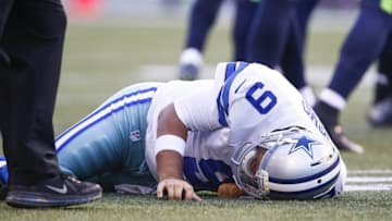 Aug 25, 2016; Seattle, WA, USA; Dallas Cowboys quarterback Tony Romo (9) lies on the turf after a tackle against the Seattle Seahawks during the first quarter at CenturyLink Field. Mandatory Credit: Joe Nicholson-USA TODAY Sports