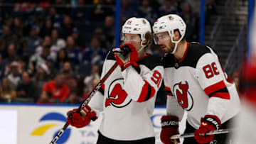 New Jersey Devils center Dawson Mercer (91) and defenseman Kevin Bahl (88) talk before a face-off during the first period against Tampa Bay Lightning at Amalie Arena. Mandatory Credit: Morgan Tencza-USA TODAY Sports