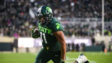 Nov 13, 2021; East Lansing, Michigan, USA; Michigan State Spartans running back Connor Heyward (11) runs for a touchdown during the second quarter against the Maryland Terrapins at Spartan Stadium. Mandatory Credit: Tim Fuller-USA TODAY Sports