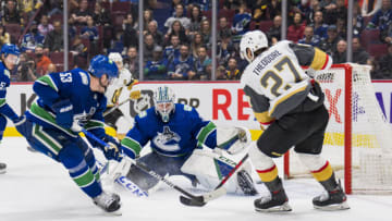 Apr 3, 2022; Vancouver, British Columbia, CAN; Vegas Golden Knights defenseman Shea Theodore (27) scores the game winning goal on Vancouver Canucks goalie Thatcher Demko (35) in overtime at Rogers Arena. Vegas won 3-2 in overtime. Mandatory Credit: Bob Frid-USA TODAY Sports