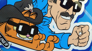 INDIANAPOLIS - AUGUST 1: A cartoon of Richard Petty and Garfield adorns the car of Kyle Petty, driver of the #45 Petty Enterprises Dodge Intrepid during practice for the NASCAR Brickyard 400 on August 1, 2003 at the Indianapolis Motor Speedway in Indianapolis, Indiana. (Photo by Jamie Squire/Getty Images)