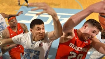 Feb 29, 2016; Chapel Hill, NC, USA; Syracuse Orange forward Tyler Lydon (20) grabs a rebound as North Carolina Tar Heels forward Justin Jackson (44) defends in the first half. The Tar Heels defeated Syracuse Orange 75-70 at Dean E Smith Center. Mandatory Credit: Bob Donnan-USA TODAY Sports