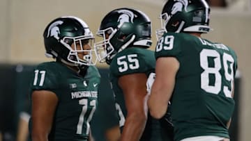 Connor Heyward, Jordan Reid and Matt Dotson, Michigan State football (Photo by Gregory Shamus/Getty Images)