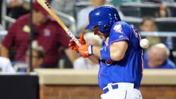Aug 16, 2014; New York, NY, USA; New York Mets third baseman David Wright (5) is hit by a pitch thrown by Chicago Cubs starting pitcher Dan Straily (not pictured) during the sixth inning at Citi Field. Mandatory Credit: Anthony Gruppuso-USA TODAY Sports
