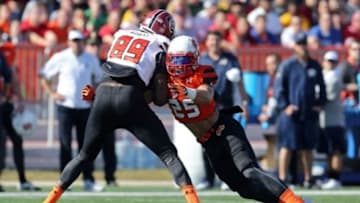 Jan 30, 2016; Mobile, AL, USA; South squad tight end Jerell Adams of South Carolina (89) is tackled by North squad safety Miles Killebrew of Southern Utah (25) in the first quarter of the Senior Bowl at Ladd-Peebles Stadium. Mandatory Credit: Chuck Cook-USA TODAY Sports