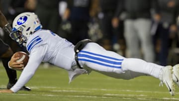 SALT LAKE CITY, UT - NOVEMBER 2 : Jaren Hall #3 of the BYU Cougars dives for a first down against the Utah State Aggies during their game at Maverick Stadium on November 2, 2019 in Logan, Utah. (Photo by Chris Gardner/Getty Images)