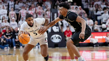 Cincinnati Bearcats guard David DeJulius dribbles against UCF Knights at Fifth Third Arena. Getty Images.