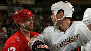 DETROIT - DECEMBER 11: Nick Boynton #4 of the Anaheim Ducks gets his elbow up on Patrick Eaves #17 of the Detroit Red Wings during a NHL game at Joe Louis Arena on December 11, 2009 in Detroit, Michigan. The Red Wings won 3-2 in overtime. (Photo by Dave Reginek/NHLI via Getty Images)