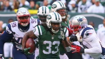 Dec 27, 2015; East Rutherford, NJ, USA; New York Jets running back Chris Ivory (33) runs with the ball during the first half of their game against the New England Patriots at MetLife Stadium. Mandatory Credit: Ed Mulholland-USA TODAY Sports