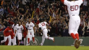 Sep 15, 2016; Boston, MA, USA; Boston Red Sox first baseman Hanley Ramirez (13) reacts with teammates after hitting a three run home run to win the game against the New York Yankees in the ninth inning at Fenway Park. The Red Sox defeated the Yankees 7-5. Mandatory Credit: David Butler II-USA TODAY Sports
