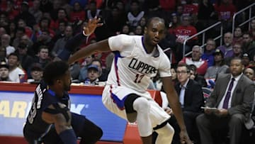 Dec 23, 2016; Los Angeles, CA, USA; LA Clippers forward Luc Mbah a Moute (12) dribbles past Dallas Mavericks guard Wesley Matthews (23) in the second half of the NBA basketball game at Staples Center. Mandatory Credit: Richard Mackson-USA TODAY Sports