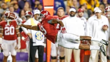 Nov 8, 2014; Baton Rouge, LA, USA; Alabama Crimson Tide wide receiver Amari Cooper (9) dives for a ball thrown behind him during the second half of a game against the LSU Tigersat Tiger Stadium. Alabama defeated LSU 20-13. Mandatory Credit: Derick E. Hingle-USA TODAY Sports