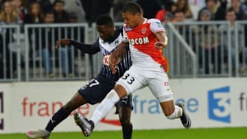 Bordeaux's Gabonese midfielder Andre Biyogo Poko (L) vies with Monaco's forward Kylian Mbappe (R) during the French League Cup football match between Bordeaux and Monaco on December 16, 2015 at the Matmut Atlantique stadium in Bordeaux, southwestern France. AFP PHOTO / NICOLAS TUCAT / AFP / NICOLAS TUCAT (Photo credit should read NICOLAS TUCAT/AFP/Getty Images)