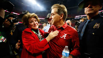 ATLANTA, GA - JANUARY 08: Head coach Nick Saban of the Alabama Crimson Tide celebrates with his wife Terry after beating the Georgia Bulldogs in overtime to win the CFP National Championship presented by AT