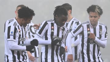 Juventus' Colombian midfielder Juan Cuadrado (L) celebrates after scoring a goal with Juventus' US midfielder Weston McKennie (R) and Juventus' Italian forward Moise Kean (C) during the Italian Serie A football match Bologna vs Juventus at Renato Dall'Ara stadium in Bologna on December 18, 2021. (Photo by Vincenzo PINTO / AFP) (Photo by VINCENZO PINTO/AFP via Getty Images)