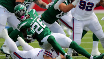 ORCHARD PARK, NY - SEPTEMBER 13: Justin Zimmer #61 of the Buffalo Bills dives to make a tackle on Le'Veon Bell #26 of the New York Jets during the first quarter at Bills Stadium on September 13, 2020 in Orchard Park, New York. (Photo by Timothy T Ludwig/Getty Images)
