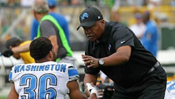 GREEN BAY, WI - SEPTEMBER 25: Head coach Jim Caldwell of the Detroit Lions shakes hands with Dwayne Washington #36 during warm-ups before a game against the Green Bay Packers at Lambeau Field on September 25, 2016 in Green Bay, Wisconsin. (Photo by Jonathan Daniel/Getty Images)