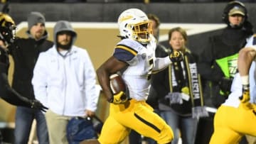 Nov 25, 2016; Kalamazoo, MI, USA; Toledo Rockets running back Kareem Hunt (3) runs in for a touchdown against the Western Michigan Broncos during the first half at Waldo Stadium. Mandatory Credit: Patrick Gorski-USA TODAY Sports