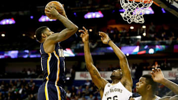 Dec 15, 2016; New Orleans, LA, USA; Indiana Pacers forward Paul George (13) shoots over New Orleans Pelicans guard E'Twaun Moore (55) and forward Terrence Jones (9) during the second quarter of a game at the Smoothie King Center. Mandatory Credit: Derick E. Hingle-USA TODAY Sports