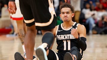 ATLANTA, GEORGIA - JANUARY 20: Trae Young #11 of the Atlanta Hawks reacts after drawing a foul on a three-point basket in the final minutes of their 122-117 loss to the Toronto Raptors at State Farm Arena on January 20, 2020 in Atlanta, Georgia. NOTE TO USER: User expressly acknowledges and agrees that, by downloading and/or using this photograph, user is consenting to the terms and conditions of the Getty Images License Agreement. (Photo by Kevin C. Cox/Getty Images)