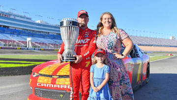 LAS VEGAS, NV - SEPTEMBER 15: Justin Allgaier, driver of the #7 BRANDT Professional Agriculture Chevrolet, pose for a photo with his wife, Ashley, and daughter, Harper, after winning the regular season championship at the NASCAR Xfinity Series DC Solar 300 at Las Vegas Motor Speedway on September 15, 2018 in Las Vegas, Nevada. (Photo by Sam Wasson/Getty Images)