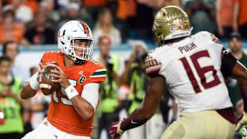 Oct 8, 2016; Miami Gardens, FL, USA; Miami Hurricanes quarterback Brad Kaaya (15) is pressured by Florida State Seminoles linebacker Jacob Pugh (16) during the first half against at Hard Rock Stadium. Mandatory Credit: Steve Mitchell-USA TODAY Sports