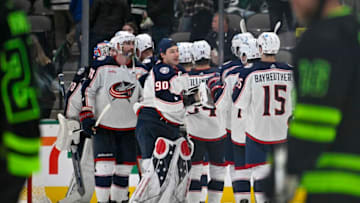 Feb 18, 2023; Dallas, Texas, USA; Columbus Blue Jackets goaltender Elvis Merzlikins (90) and Blue Jackets celebrate the win over the Dallas Stars at the American Airlines Center. Mandatory Credit: Jerome Miron-USA TODAY Sports