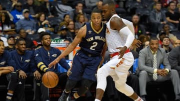 Nov 22, 2016; Atlanta, GA, USA; New Orleans Pelicans guard Tim Frazier (2) dribbles against the defense of Atlanta Hawks forward Paul Millsap (4) during the first half at Philips Arena. Mandatory Credit: Dale Zanine-USA TODAY Sports