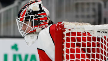 BOSTON, MA - FEBRUARY 13: Devon Levi #1 of the Northeastern Huskies tends goal during a game against the Harvard Crimson during NCAA hockey in the championship game of the annual Beanpot Hockey Tournament at TD Garden on February 13, 2023 in Boston, Massachusetts. The game officially ended in a 2-2 tie with the Huskies winning the shootout 1-0 to capture the title. (Photo by Richard T Gagnon/Getty Images)