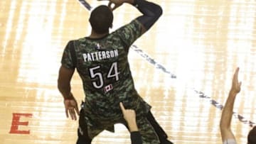 Nov 11, 2014; Toronto, Ontario, CAN; Toronto Raptors forward Patrick Patterson (54) celebrates after making a three-point shot against the Orlando Magic at Air Canada Centre. The Raptors beat the Magic 104-100. Mandatory Credit: Tom Szczerbowski-USA TODAY Sports