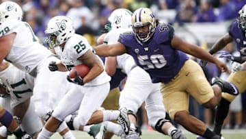 Sep 17, 2016; Seattle, WA, USA; Washington Huskies defensive lineman Vita Vea (50) pursues Portland State Vikings running back Nate Tago (25) during the second quarter at Husky Stadium. Mandatory Credit: Jennifer Buchanan-USA TODAY Sports