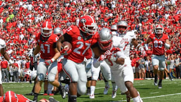 Sep 10, 2016; Athens, GA, USA; Georgia Bulldogs running back Nick Chubb (27) scores a touchdown against Nicholls State Colonels defensive back Corey Abraham (31) during the first quarter at Sanford Stadium. Mandatory Credit: Dale Zanine-USA TODAY Sports