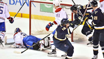 Jan 16, 2016; St. Louis, MO, USA; St. Louis Blues right wing Ty Rattie (18) celebrates scoring a goal against the Montreal Canadiens during the third period at Scottrade Center. St. Louis defeated Montreal 4-3 in overtime. Mandatory Credit: Jasen Vinlove-USA TODAY Sports