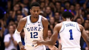DURHAM, NC - NOVEMBER 10: Javin DeLaurier #12 and Trevon Duval #1 of the Duke Blue Devils react during their game against the Elon Phoenix at Cameron Indoor Stadium on November 10, 2017 in Durham, North Carolina. (Photo by Lance King/Getty Images)