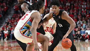 Feb 28, 2023; Lincoln, Nebraska, USA; Michigan State Spartans guard A.J. Hoggard (11) dribbles against Nebraska Cornhuskers forward Derrick Walker (13) in the second half at Pinnacle Bank Arena. Mandatory Credit: Steven Branscombe-USA TODAY Sports